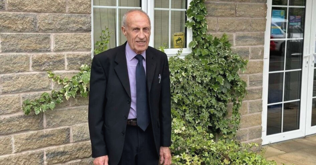 Malcolm standing outside the Community Centre in June 2024.