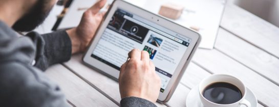 worker-reading-news-with-tablet